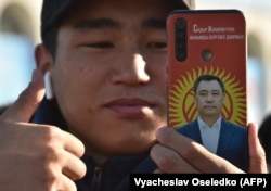 A supporter of Kyrgyz President-elect Sadyr Japarov attends a rally on Ala-Too Square in Bishkek on January 11.