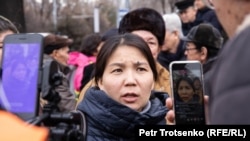 Inga Imanbai talks to reporters in Almaty on February 22.