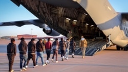 A photo released in January 2025 showing migrants in the US boarding a deportation flight.
