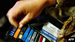 A drop in the U.S. credit rating could hit consumers in higher interest rates.