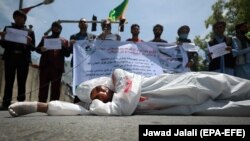 An Afghan man protests the migrant deaths outside the Iranian Embassy in Kabul on May 7.
