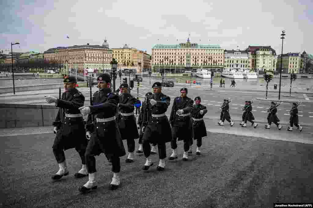 Soldiers of Sweden's Royal Guard patrol near the palace in Stockholm on March 25. These photos -- remarkable for their normality as the rest of Europe endures varying degrees of lockdown and mass business closures -- illustrate Sweden’s unusual response to the coronavirus pandemic.