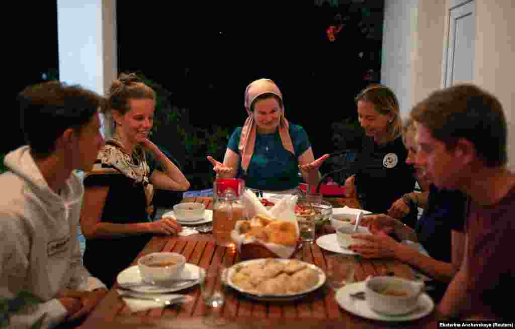Leila Achishvili (center), a guesthouse owner in Jokolo whose two sons were killed fighting in Syria, at dinner with tourists. Photographer Anchevskaya told RFE/RL: “In Pankisi, they say if you are a guest of someone in the village, you are the guest of the whole village. These people have been through a lot and still face prejudice and conflicts, but they respect their guests, traditions, and nature they live in, and they want to share it with others.”