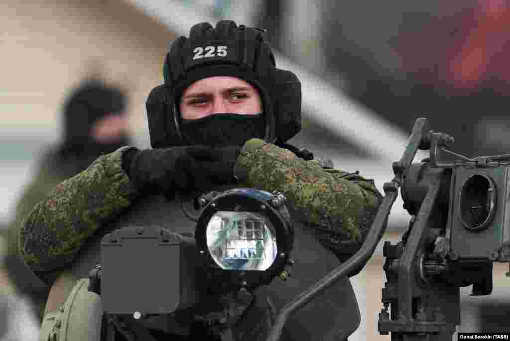 A soldier looks out of a BMP-3 infantry fighting vehicle.&nbsp;Kremlin spokesman Dmitry Peskov has said that no decision had been made on whether to postpone Victory Day celebrations, but that authorities were considering other &quot;options.&quot;&nbsp;