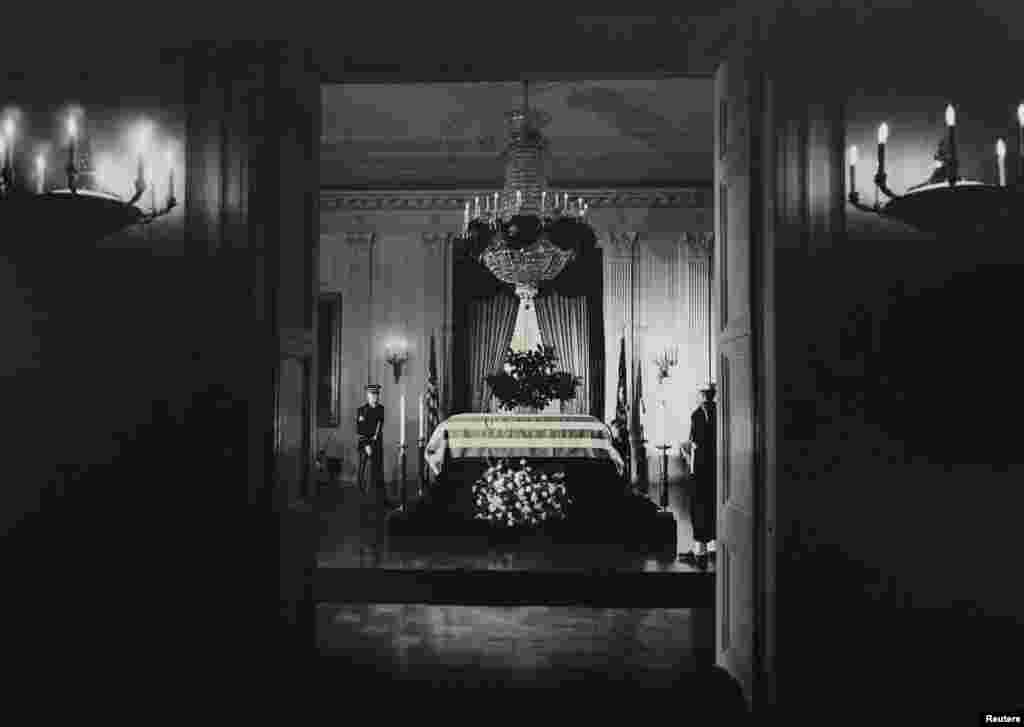 President John F. Kennedy's body lies in state in the East Room of the White House early on November 23, 1963.