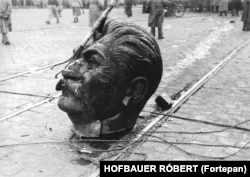 The battered head of Budapest’s Stalin statue after being dragged through the streets. The 1956 uprising began with a student protest and flared into a full-scale rebellion against Hungary’s communist regime.