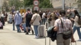 People leaving Iran via the Agarak border crossing with neighboring Armenia.