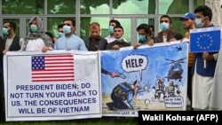 Afghan former interpreters for the U.S. and NATO forces gather during a demonstration in downtown Kabul on April 30.