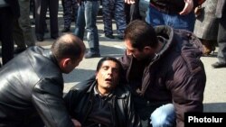 Ten people were killed and scores injured in the March violence.