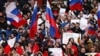 People attend a concert marking the seventh anniversary of Russia's annexation of Crimea at Luzhniki Stadium in Moscow on March 18.