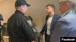 Volodymyr Zelenskiy (second from right), the apparent next president of Ukraine, was fined by police for showing his marked ballot.