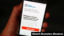 The Smart Voting or "Navalny" app is seen on an iPhone screen in Moscow.