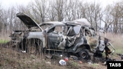 A burned-out OSCE vehicle that hit a land mine in eastern Ukraine on April 23, killing one paramedic. 