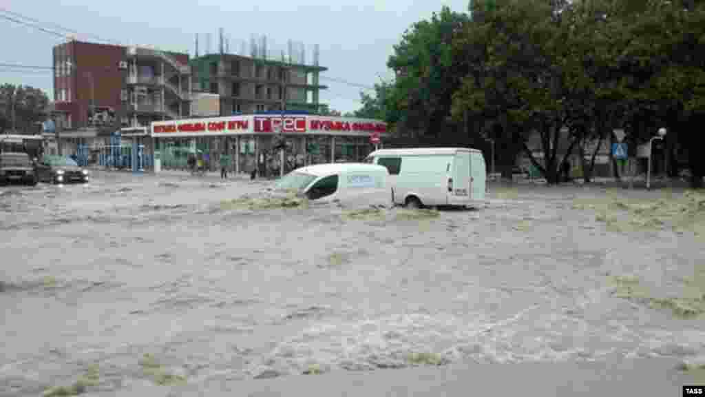 Flooding hits the town of Gelendzhik, where two months of rain is reported to have fallen in 24 hours.