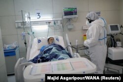 A patient being treated for coronavirus at a hospital in Tehran.