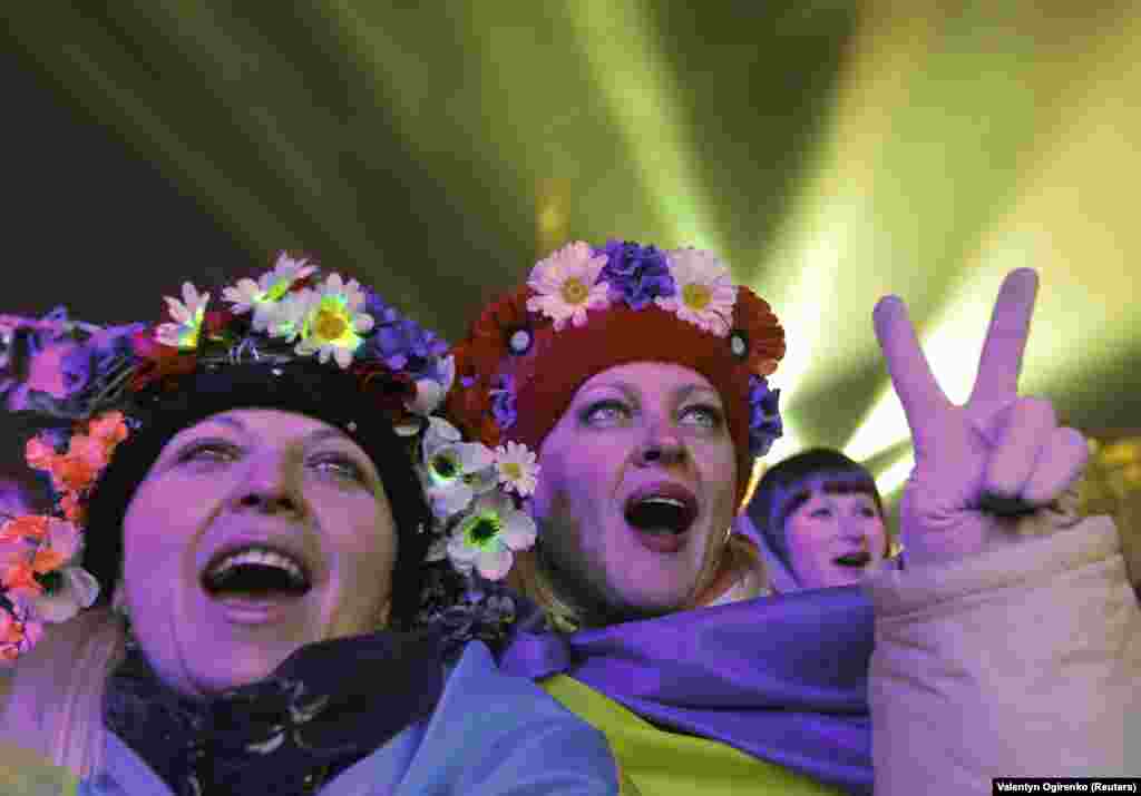 Pro-European protesters take part in New Year celebrations on Independence Square in central Kyiv on January 1, 2014.