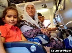 Tajik authorities removed 10-year-old Fatima Davlatova (left) and her grandmother (right) from an international flight just before takeoff.
