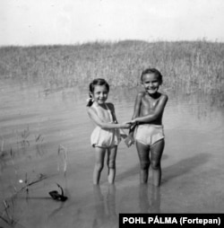 The Fortepan archive also holds precious moments of humanity far removed from the politics and conflict of the period. This snap captures two young besties in the shallows of Lake Balaton in 1954.