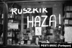 A bookstore window scrawled with the phrase “Russians go home!” Hungarians fought bitter, deadly battles with Soviet troops inside the country during the uprising.