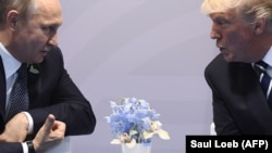 U.S. President Donald Trump (right) and Russian President Vladimir Putin talk on the sidelines of the G20 summit in Hamburg in July 2017.