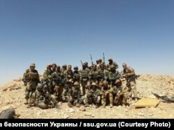 A group picture of Russian soldiers who are believed to have fought as mercenaries in Syria. (file photo)
