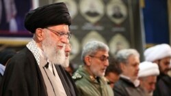 Iranian Supreme Leader Ayatollah Ali Khamenei prays over Qasem Soleimani's body in Tehran on January 6.
