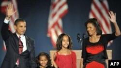 Barack Obama and his family celebrate victory in Chicago.
