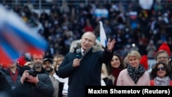 Russian President Vladimir Putin delivers a speech during a rally in Moscow on March 3.