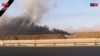 Це зображення, взяте з відео агентства IRINN 13 червня 2025 року, показує те, що телебачення описало як дим, що клубочиться від вибухів у Натанзі після того, як заяви Ізраїлю про удари по іранських ядерних та військових об'єктах