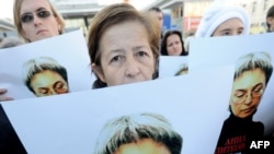 Human rights activists at a rally in honor of slain journalist Anna Politkovskaya in Moscow on October 7, 2010