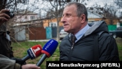 Mykola Semena speaks to reporters in Simferopol in March.