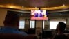 A television screen shows U.S. President Donald Trump as Palestinians follow the news on UAE 's agreement with Israel on normalising relations, in Hebron in the Israeli-occupied West Bank August 13, 2020.