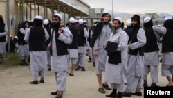Newly freed Taliban prisoners are seen at Bagram prison, north of Kabul, on April 11.