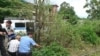 Investigators at the site of a June 29 blast at Gagry