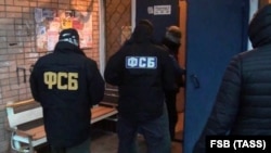 Russian Federal Security Service (FSB) officers detain suspected members of a terrorist group that planned suicide bombings in the Moscow region on December 12.