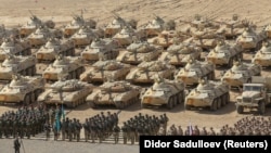 Russian, Kazakh, and Belarusian service members line up during military drills carried out by the Russia-led Collective Security Treaty Organization (CSTO) near Tajikistan's border with Afghanistan on October 23.

