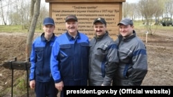 Alyaksandr Lukashenka (second from left) poses with his sons (left to right) Mikalay, Viktar, and Dzmitry in 2018.