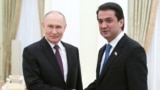 Russian President Vladimir Putin (left) and Rustam Emomali, the son of Tajik President Emomali Rahmon meet at the Kremlin. (file photo)