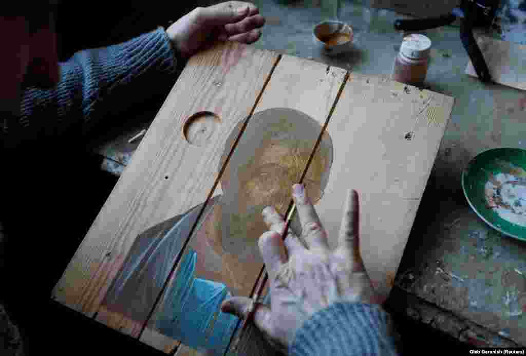 Klymenko got the idea for ammo-box icons during a 2014 visit to a military base when he noticed that the crates resemble wooden panels used for ancient religious art.
