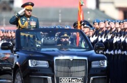 Russian Defense Minister Sergei Shoigu inspects the troops.