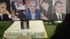 Lebanon -- A Lebanese woman walks past the tomb of slain Lebanese prime minister Rafiq Hariri in downtown Beirut, 30Jun2011