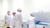 Туркменские медработники рассматривают российскую вакцину против COVID-19 «Спутник V». Кадр из репортажа телеканала «Алтын асыр», гостелевидения Туркменистана. 29 января 2021 г.