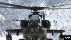 A U.S. Apache helicopter at a forward operating base in Nijrab, Afghanistan, in mid-February